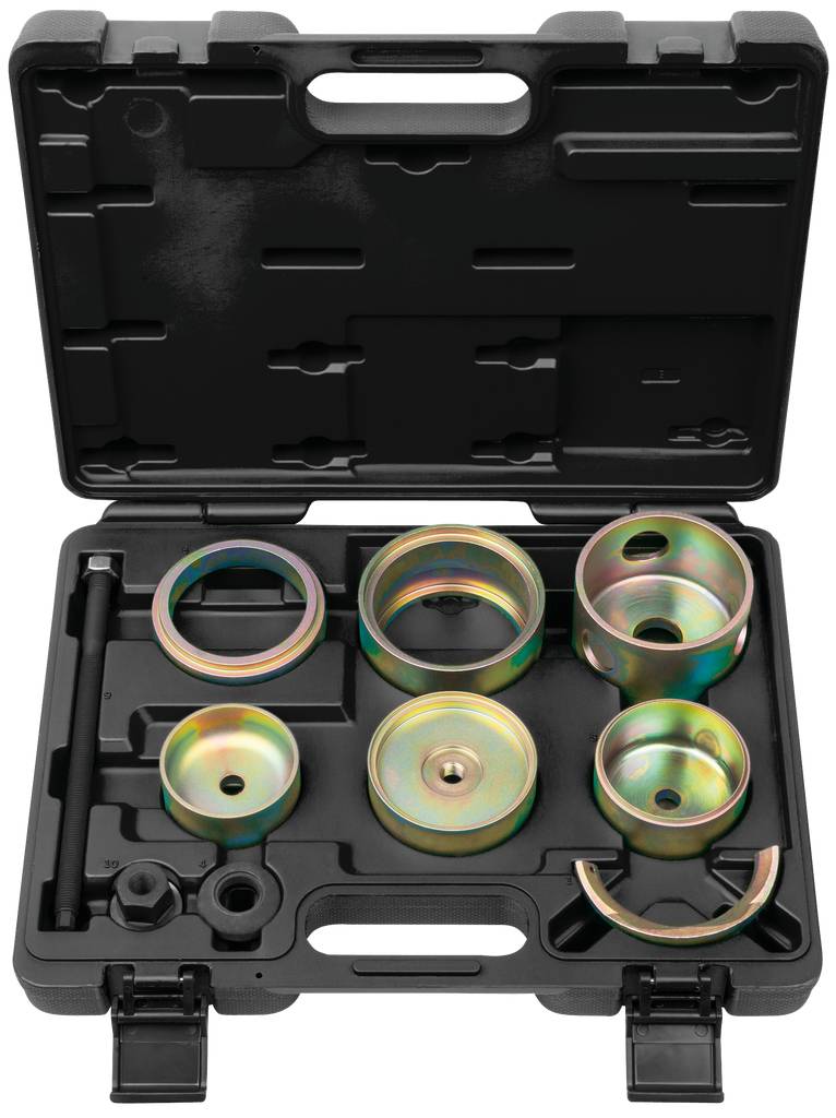 Ein schwarzer Kunststoffkoffer mit verschiedenen runden Metallwerkzeugen in verschiedenen Größen und Formen, angeordnet in Fächern.