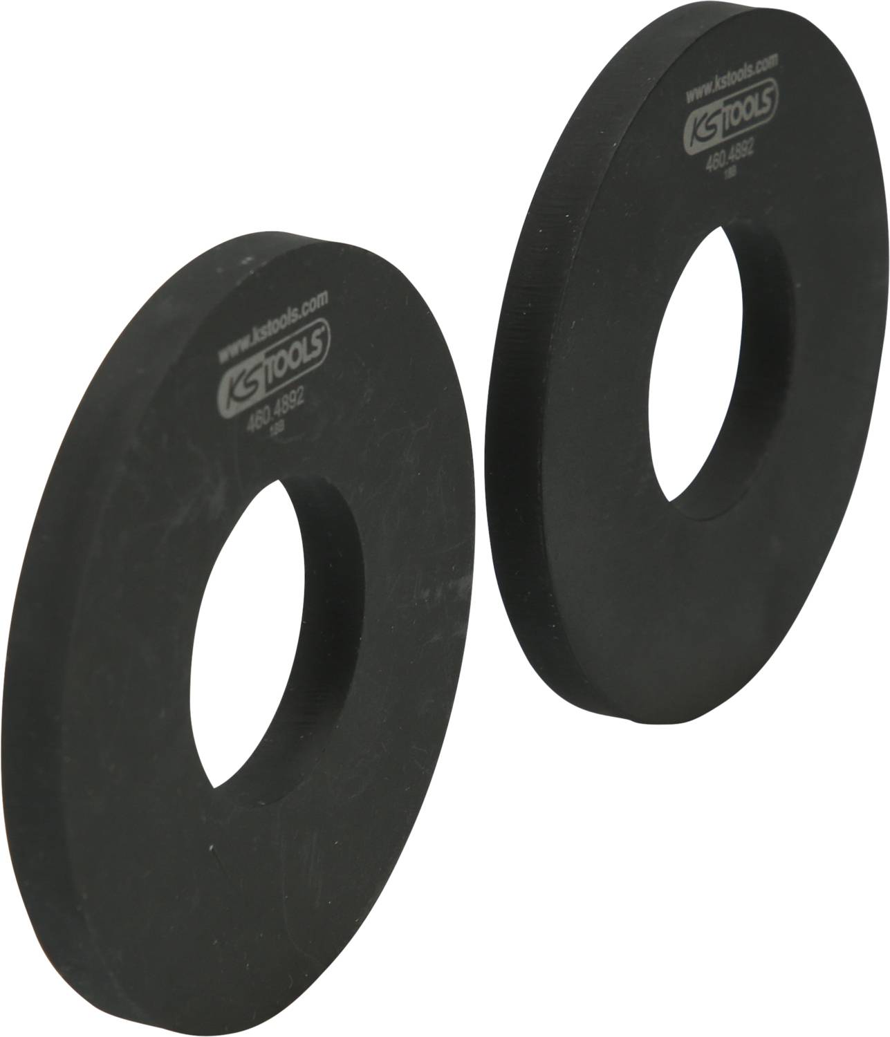 Zwei schwarze Ringe aus Metall mit einem Loch in der Mitte, möglicherweise Teil eines Werkzeugs oder Maschinenzubehörs.