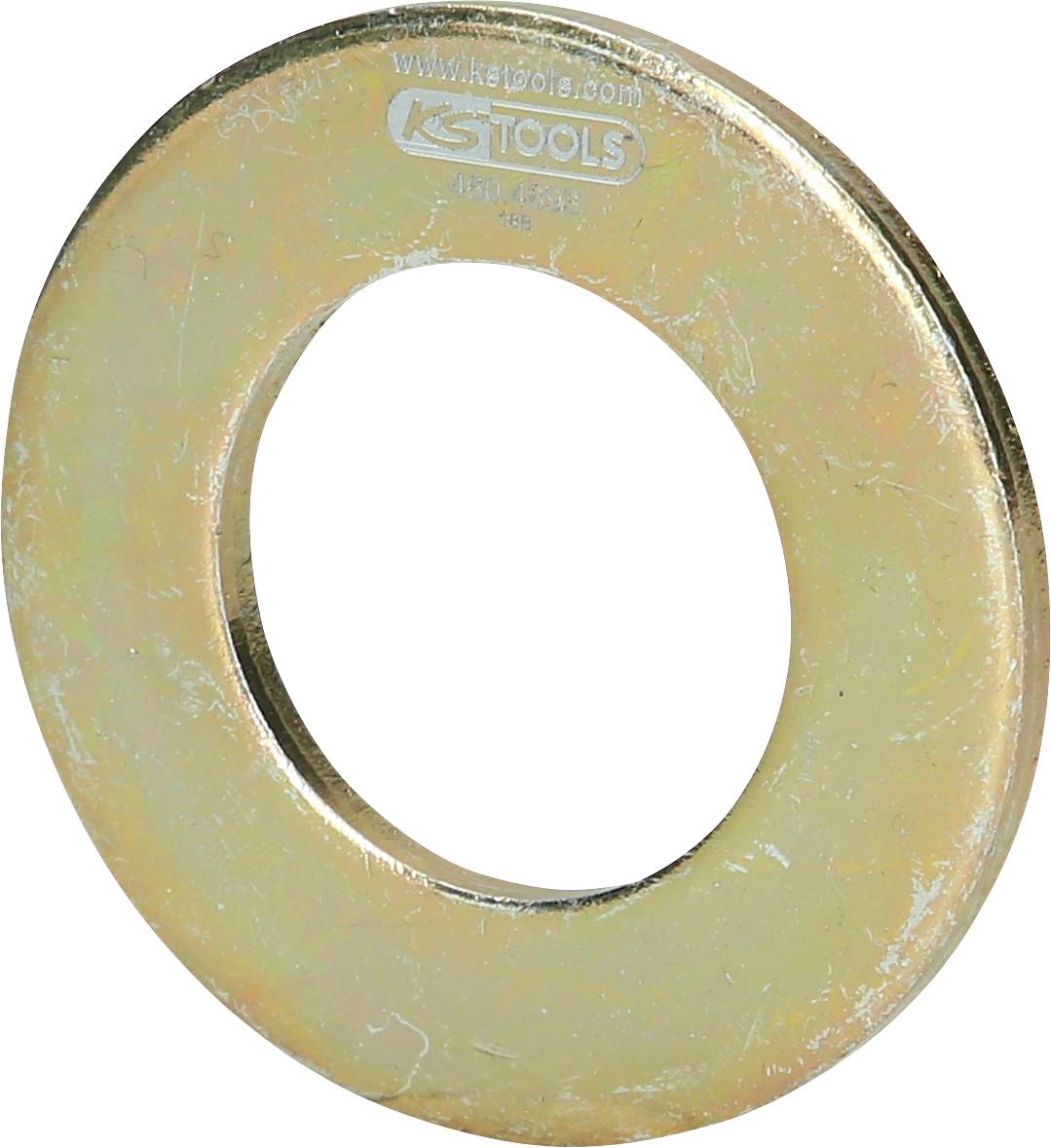 Große runde Metallscheibe mit einer Öffnung in der Mitte, leicht glänzend, möglicherweise als Unterlegscheibe in Werkzeugen verwendet.