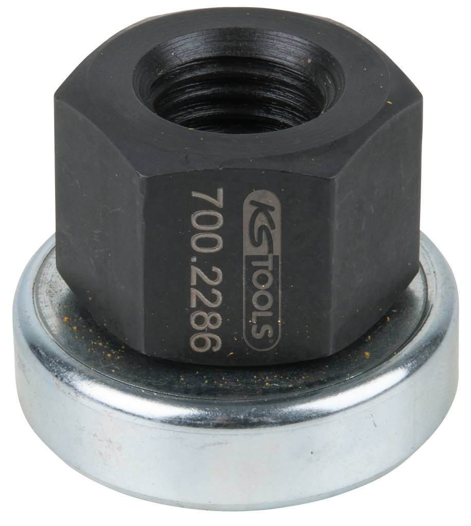 Schwarze Sechskantmutter mit Aufschrift 'KS TOOLS 700.2286', sitzt auf einer silbernen Metallscheibe.