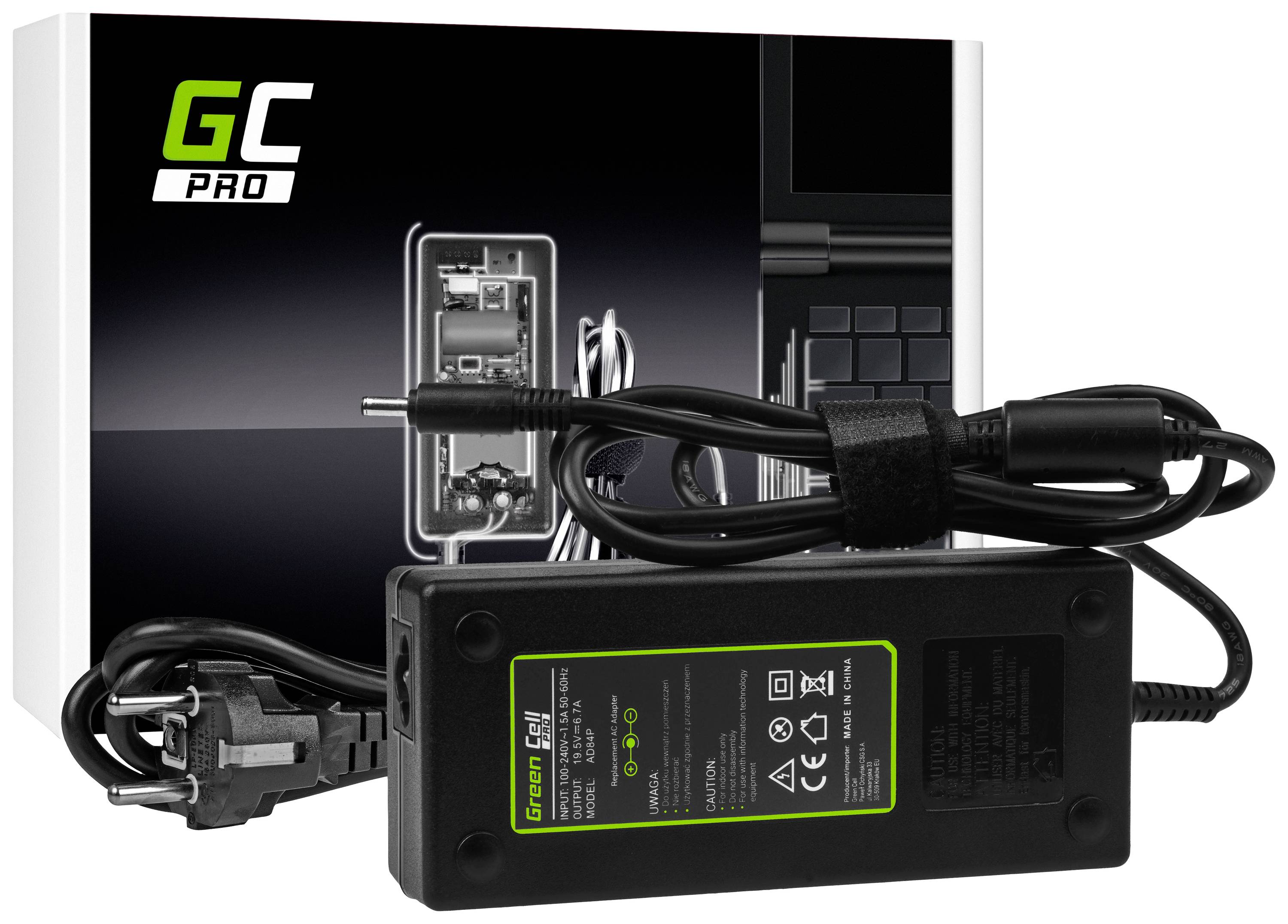 Ein schwarzes Netzteil mit Kabel und Stecker liegt vor einer Verpackung mit dem Aufdruck 'GC Pro' und technischen Zeichnungen.