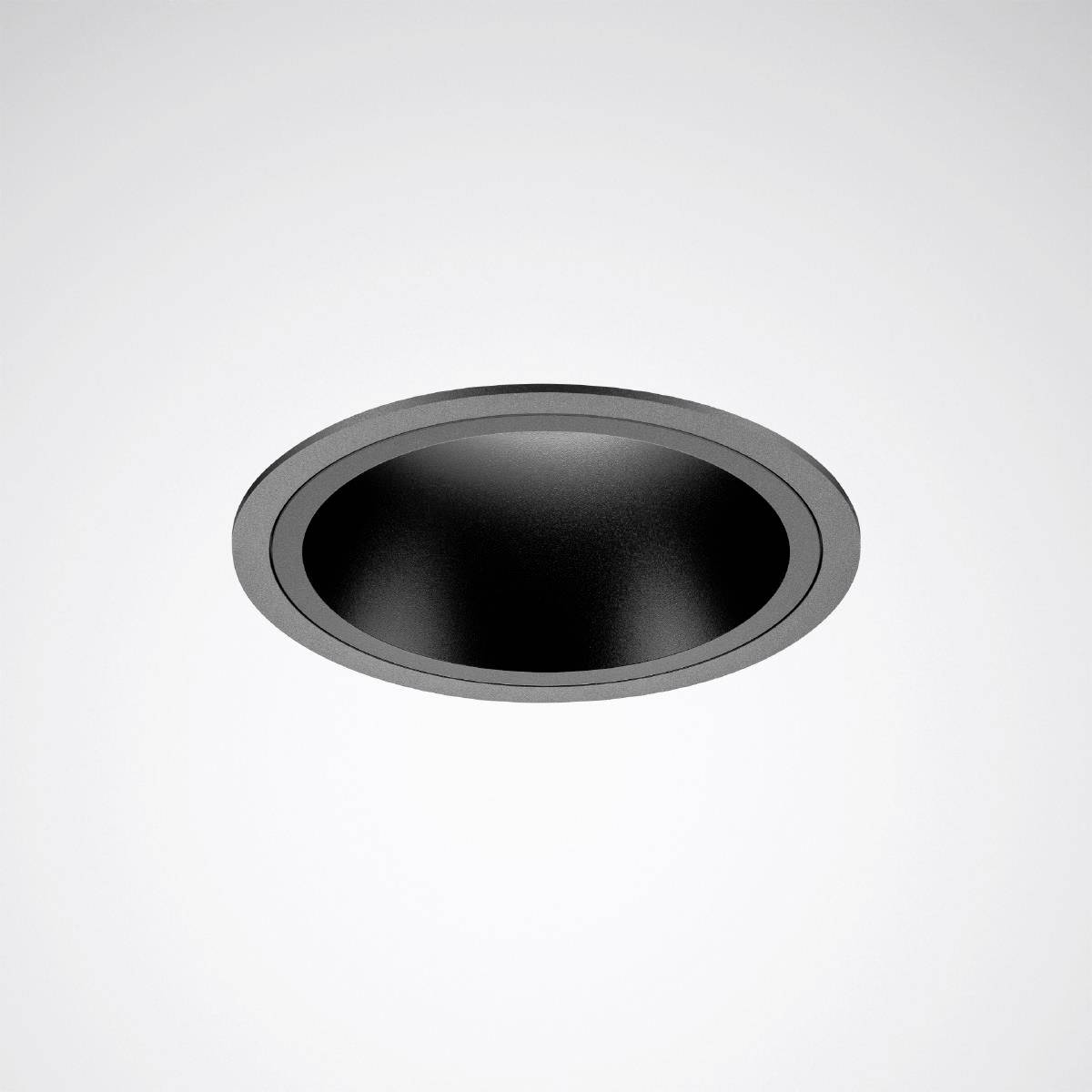 Ein rundes, schwarzes, in die Decke eingebautes Deckenlicht, das in einem modernen Innenraum verwendet wird.