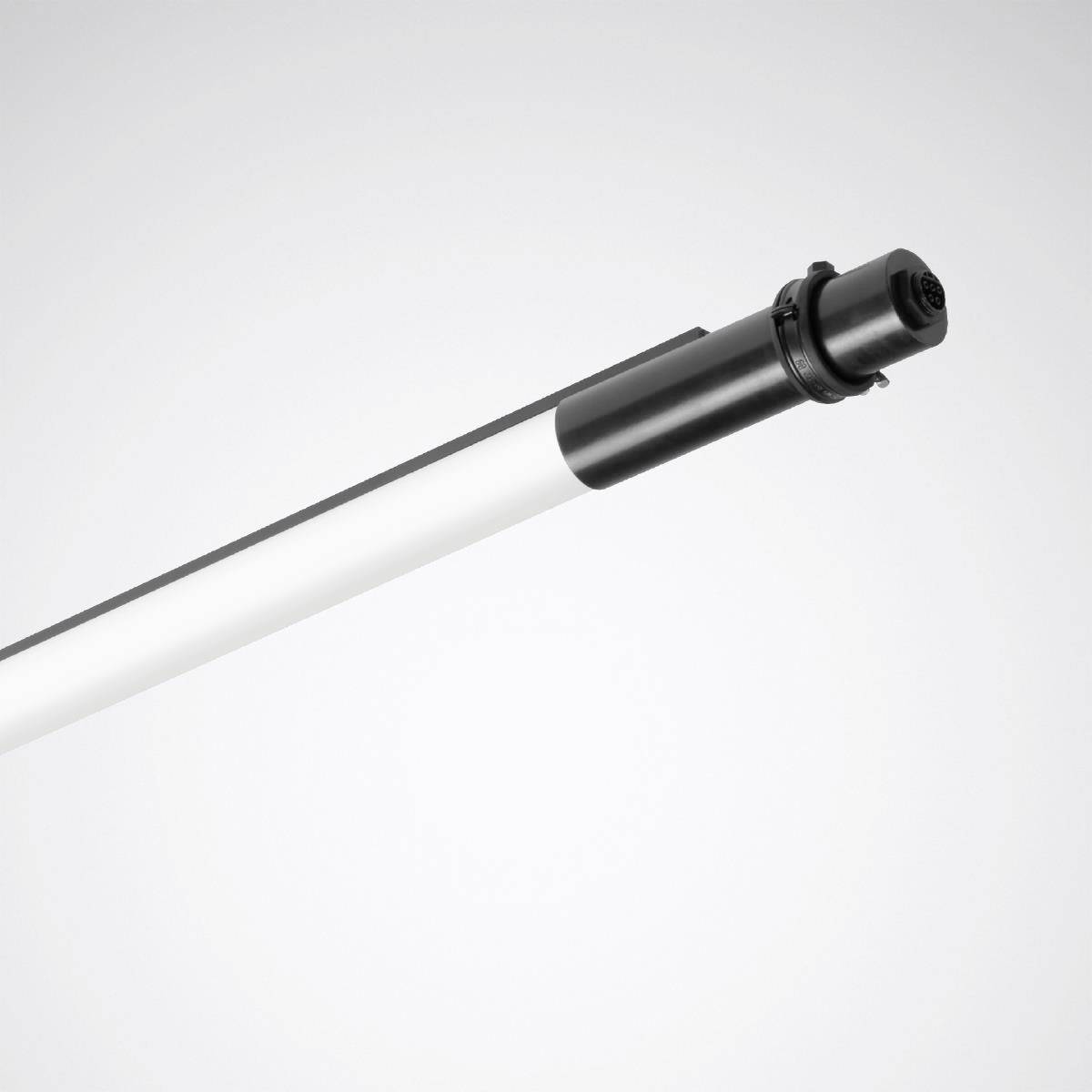 Ein weiß- und schwarzfarbiger LED-Stab liegt diagonal auf einem grauen Hintergrund.