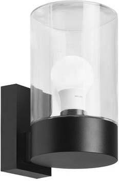 Moderne Wandlampe mit schwarzem Sockel und klarem Glaszylinder, in dem eine Glühbirne sichtbar ist.