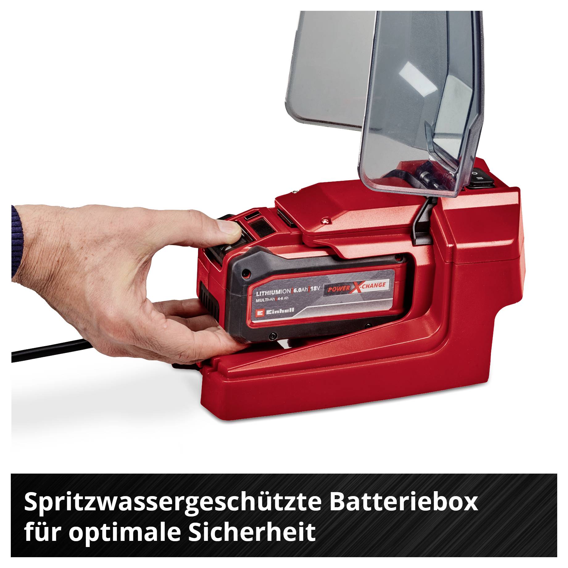 Eine rote Einhell-Pumpe mit einem langen Kabel, das an eine Steuerbox angeschlossen ist.