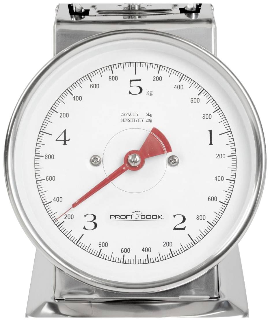 Küchenwaage aus Metall mit Skala, zeigt 5 kg als Höchstgewicht. Rote Nadel, Markierungen in 100g-Schritten, Bauch und Tisch verstellbar.