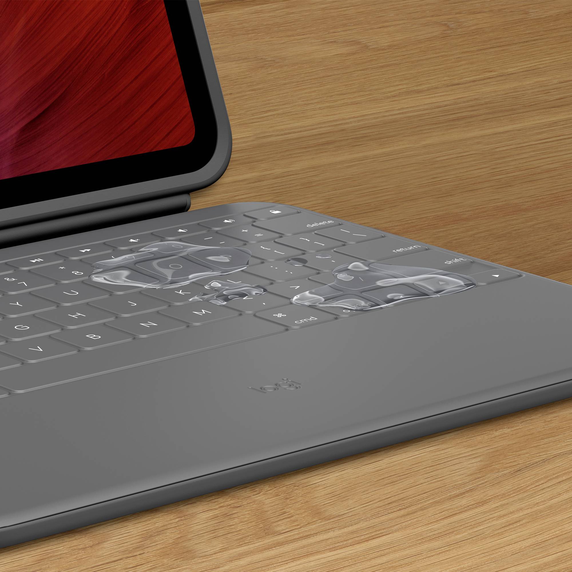 Ein Laptop mit transparenten Einlegekarten, die auf der Tastatur liegen. Die Einlegekarten zeigen verschiedene Shortcuts.