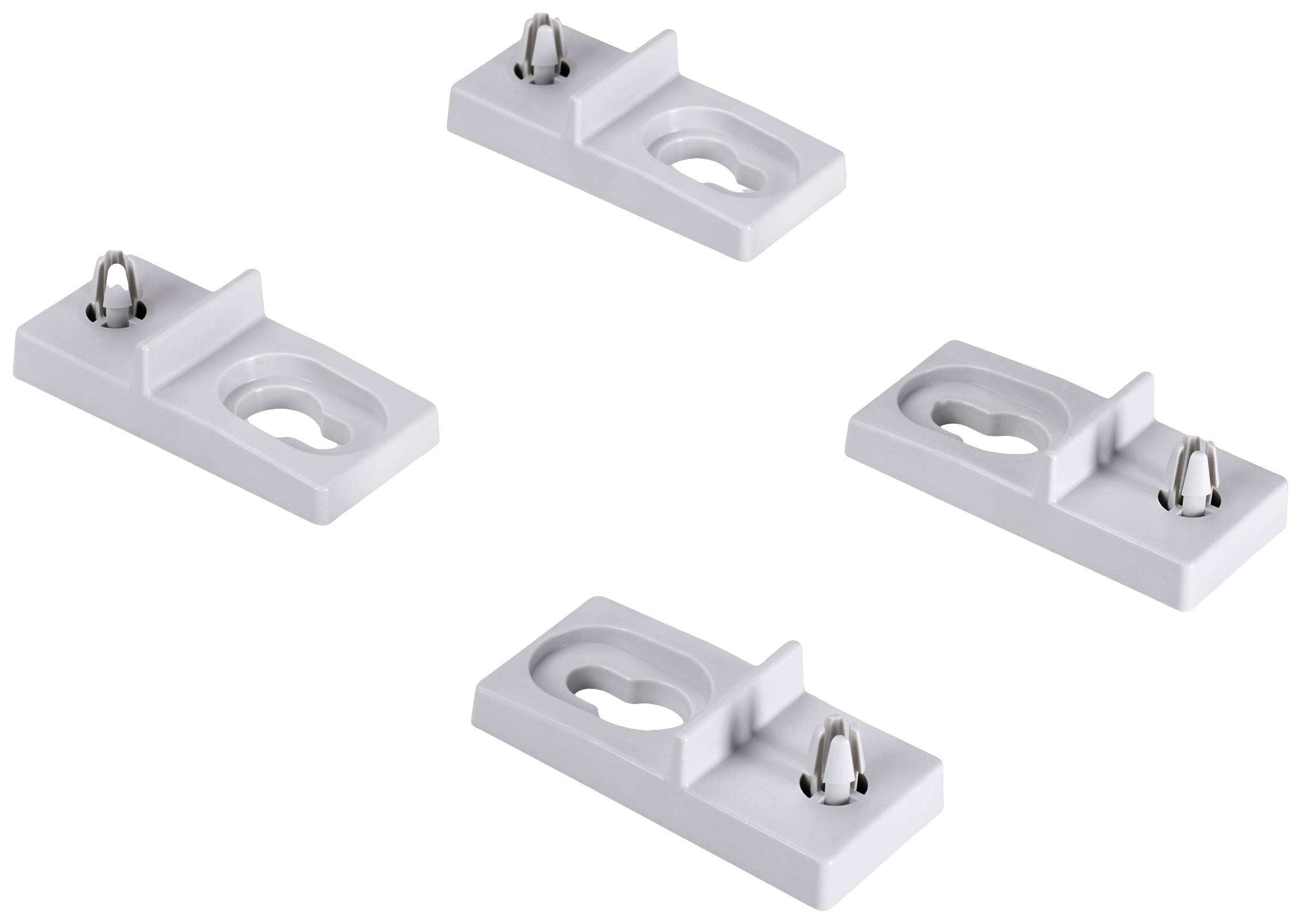 Weiße Halterungen mit Metallklammern, die auf einer weißen Oberfläche verteilt sind. Sie scheinen für die Befestigung gedacht zu sein.