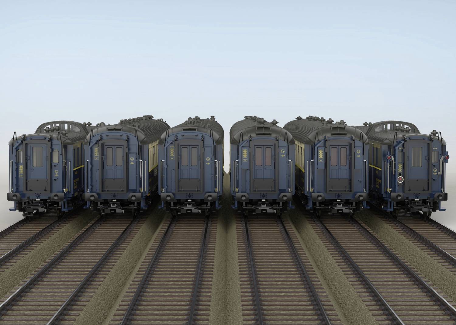 Sechs blaue Zugwaggons stehen nebeneinander auf parallelen Gleisen, von hinten betrachtet, bei klarem Wetter.