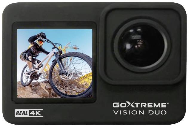 Kompaktkamera mit großem Objektiv und Bildschirm. Auf dem Bildschirm ist ein Mountainbiker in Aktion auf felsigem Untergrund zu sehen.