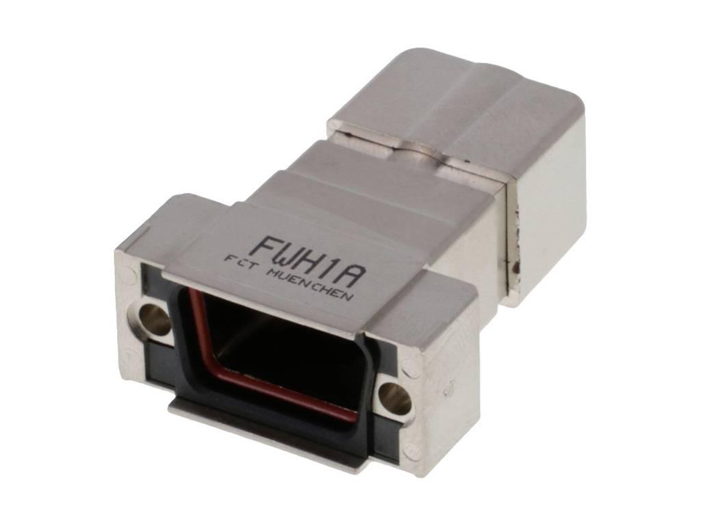 Das Bild zeigt einen silberfarbenen Metalladapter mit der Aufschrift 'FWK1A FCT Huenchen'.