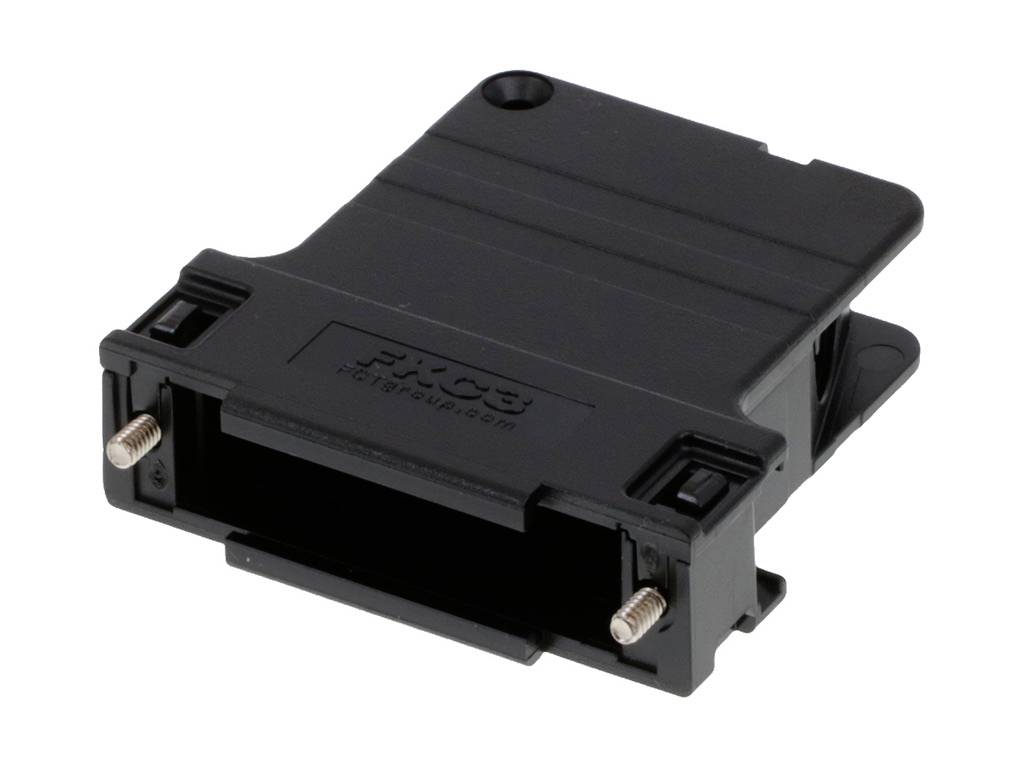 Ein schwarzes, rechteckiges Kunststoffteil mit Schraubenlöchern; möglicherweise ein elektrisches oder mechanisches Bauteil.