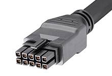 Ein schwarzer, mehrpoliger Stecker für elektronische Verbindungen, mit mehreren rechteckigen Pins in zwei Reihen angeordnet.