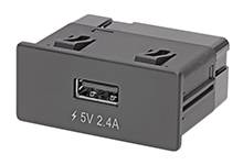 Schwarzer USB-Anschluss mit Blitzsymbol und Beschriftung '5V 2.4A', geeignet zum Aufladen elektronischer Geräte.