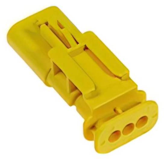 Ein gelber rechteckiger Stecker mit drei kreisförmigen Löchern auf einer Seite, der für elektrische Verbindungen verwendet wird.