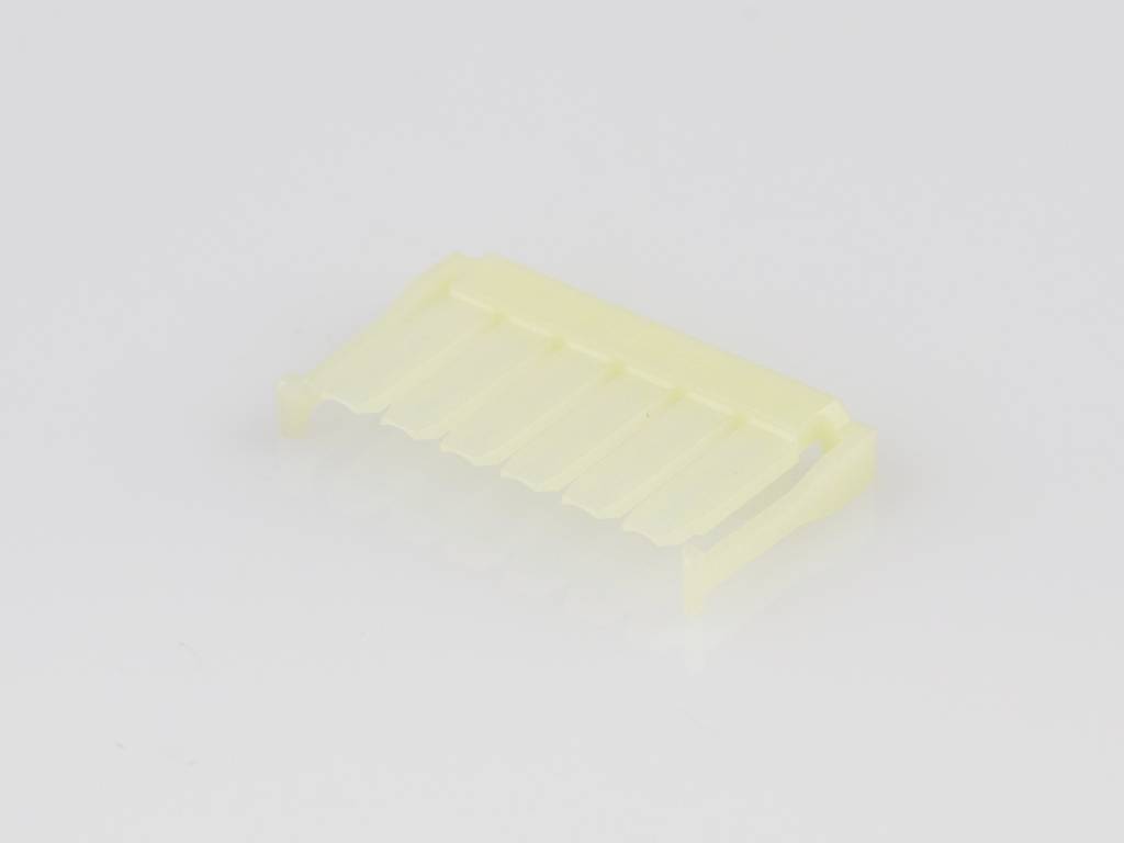 Ein transparentes, gelbes Kunststoffteil mit mehreren parallelen Rippen. Es scheint ein technisches oder mechanisches Bauteil zu sein.