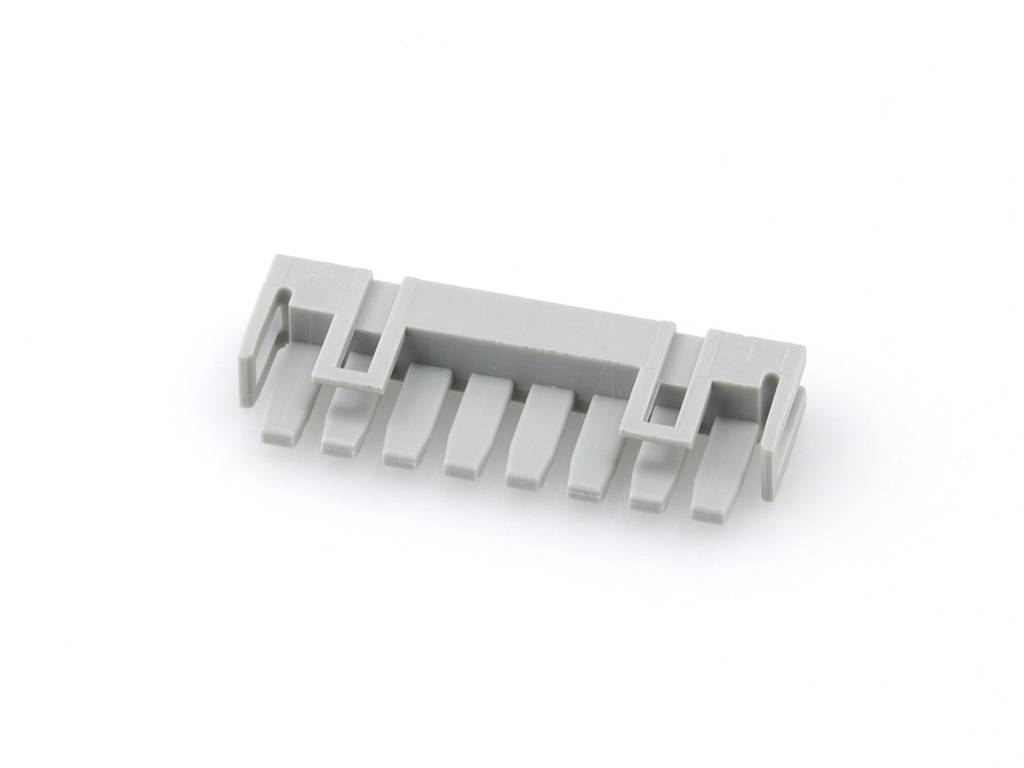 Grauer, rechteckiger Kunststoffstecker mit mehreren Pins, möglicherweise ein elektronisches Bauteil zur Verbindung von Komponenten.