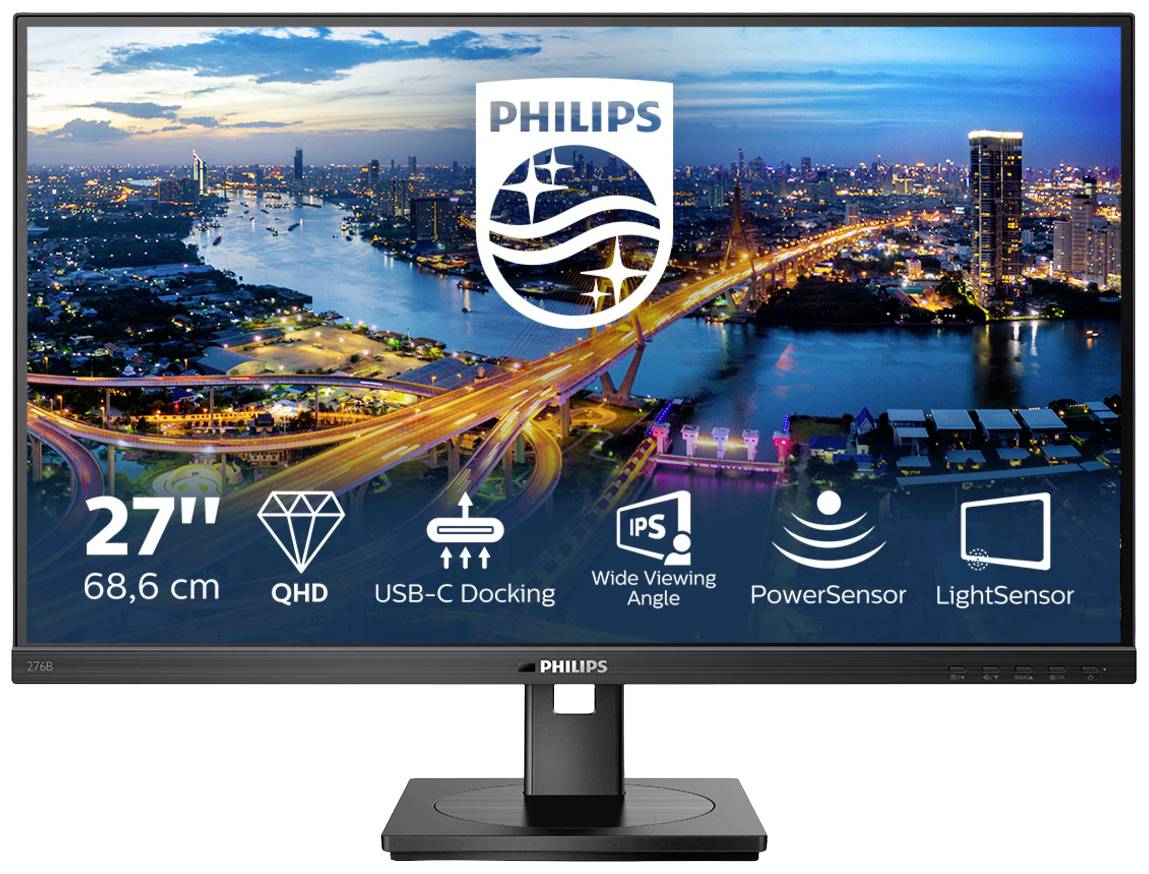 Ein 27-Zoll Philips Monitor zeigt eine nächtliche Stadtansicht. Funktionen: QHD, USB-C, weiter Betrachtungswinkel, PowerSensor, LightSensor.