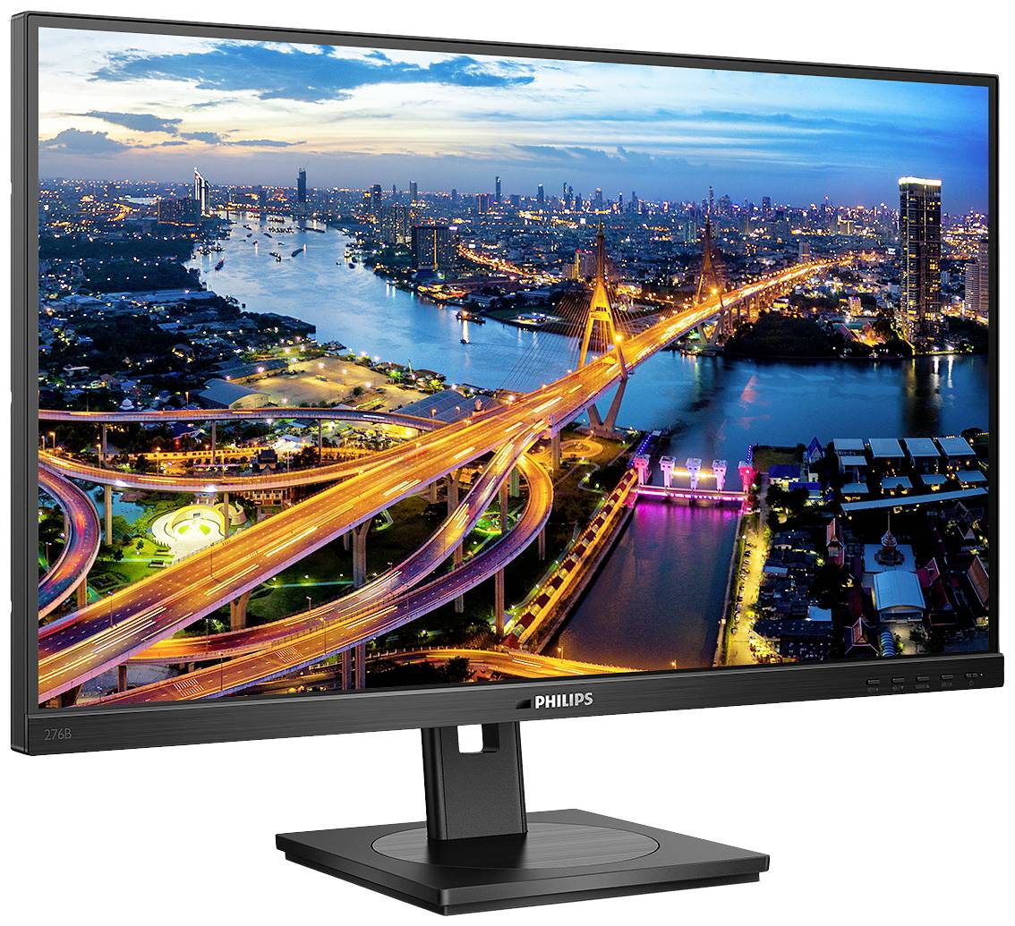 Ein Computerbildschirm zeigt eine farbenfrohe Stadtansicht bei Nacht, mit hell erleuchteten Brücken und Gebäuden entlang eines Flusses.