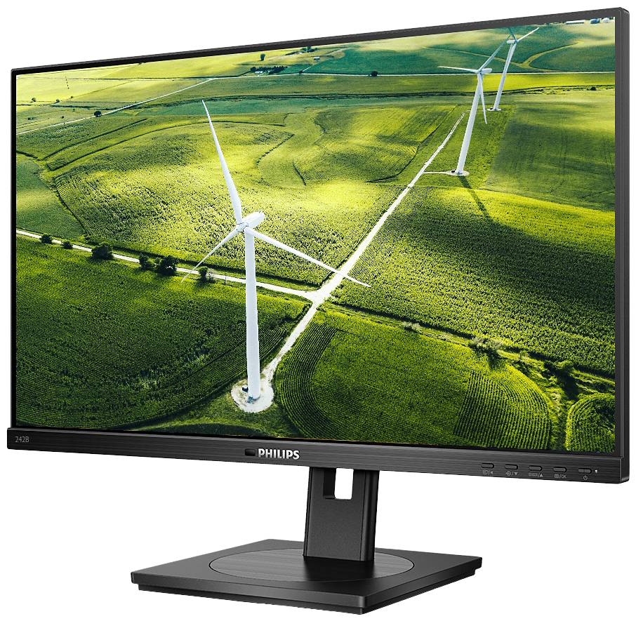 Ein Monitor zeigt ein Panoramabild von grünen Feldern mit Windkraftanlagen, was auf das Thema erneuerbare Energien hinweist.