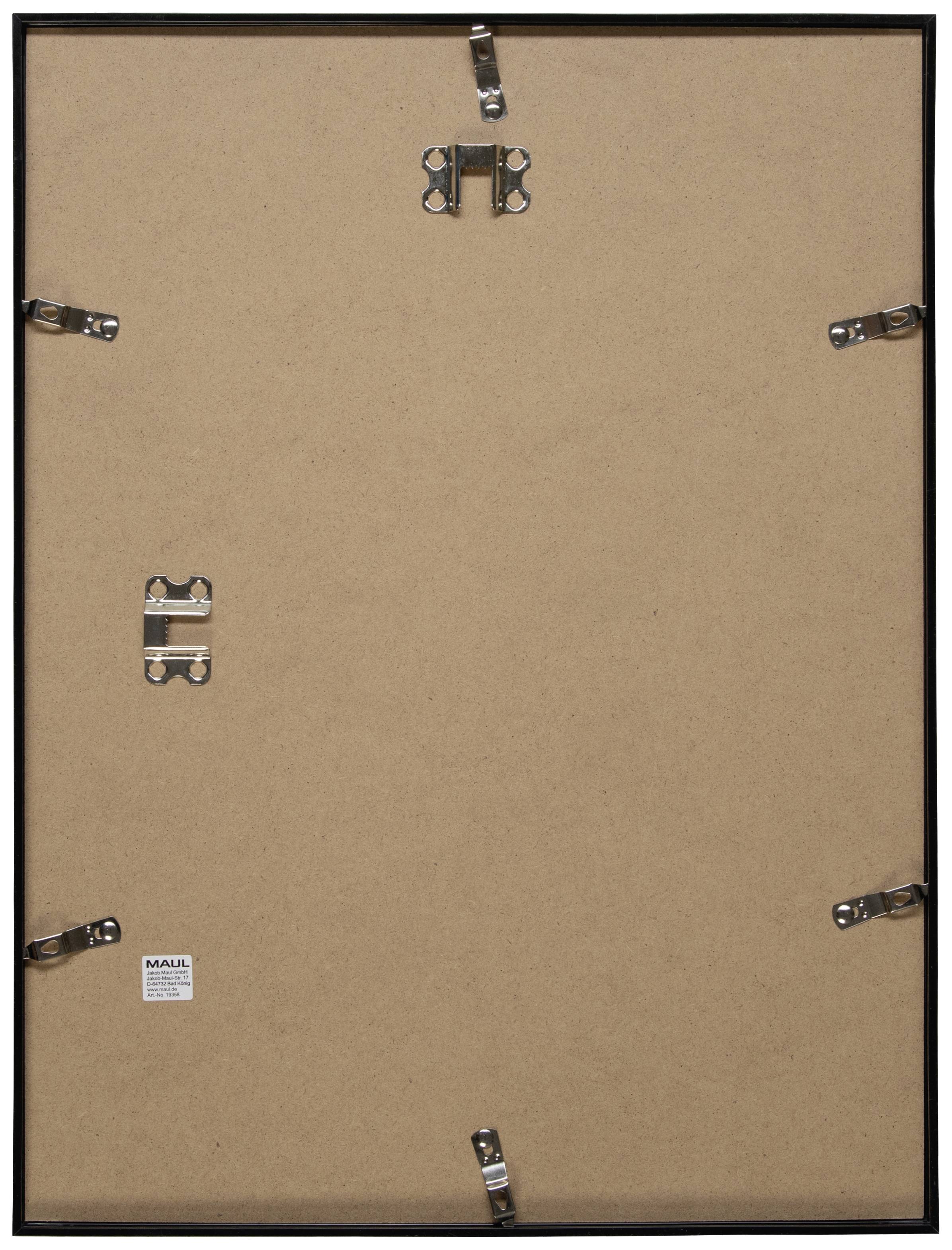 'Rückseite eines Bilderrahmens' zeigt eine braune Holz- oder Kartonoberfläche mit Metallclips zur Befestigung.