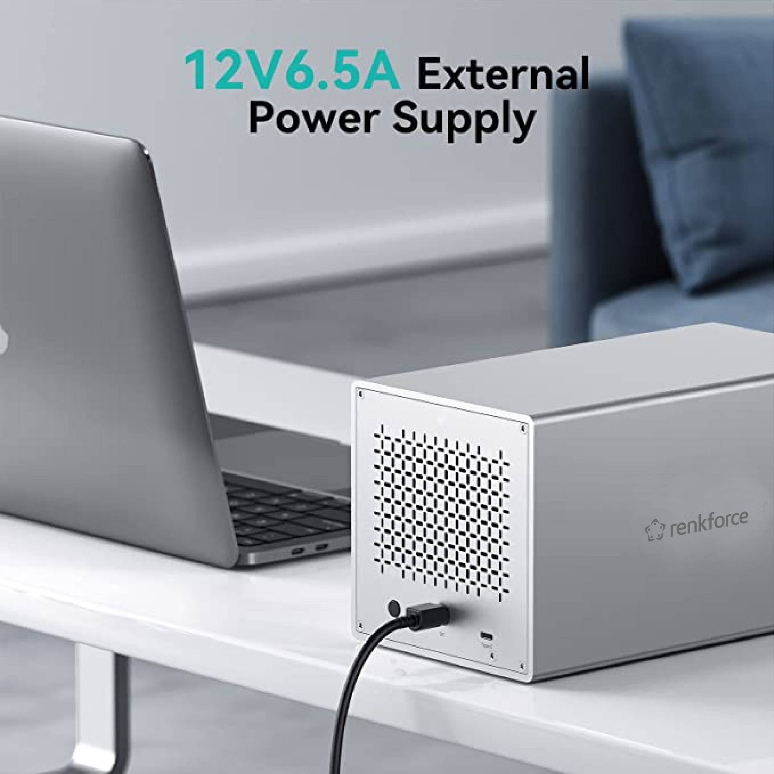 Externe Netzteil-Box neben einem Laptop. Aufschrift: '12V 6.5A External Power Supply'.