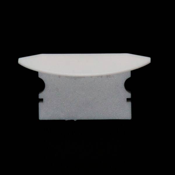 Ein Rasierklingenhalter aus weißem Kunststoff mit einer eingelegten metallischen Rasierklinge, vor schwarzem Hintergrund.