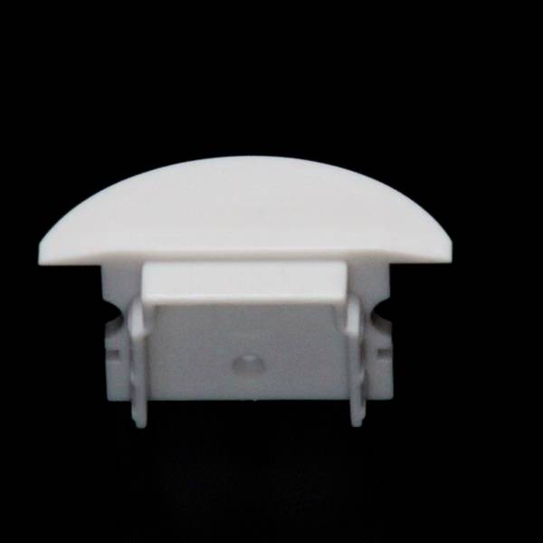 Ein weißer, halbkreisförmiger Kunststoffclip vor schwarzem Hintergrund. Dient als Kabel- oder Schlauchhalter.