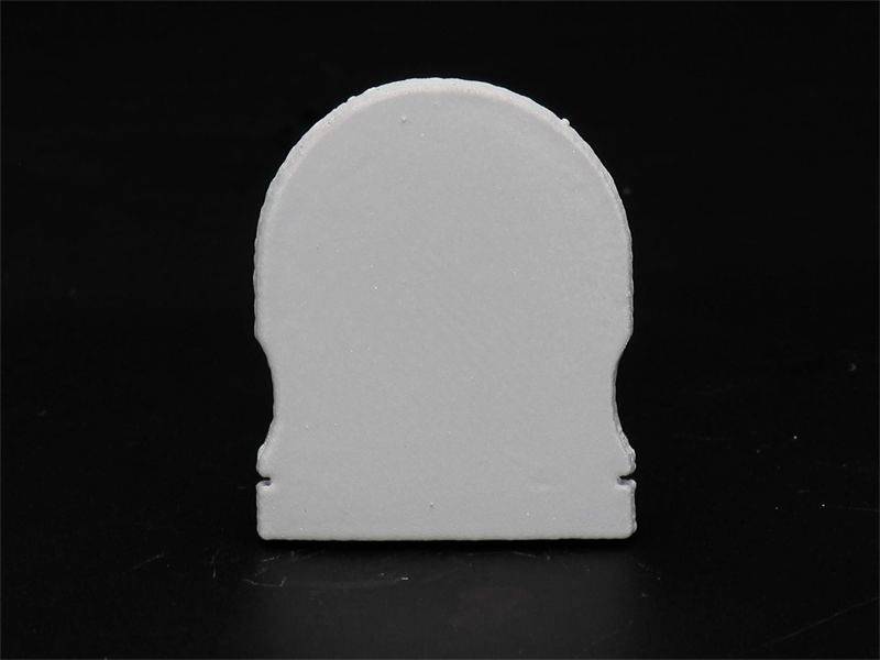 Weiße Grabstein-Silhouette vor schwarzem Hintergrund.