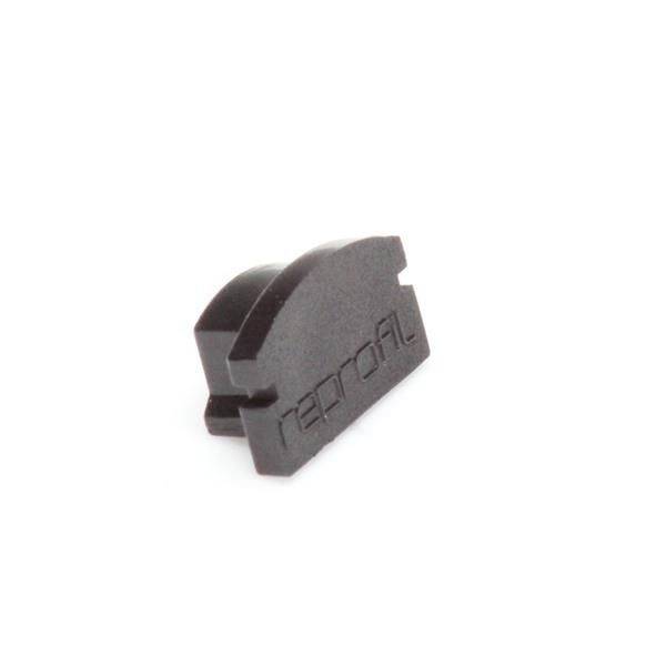 Schwarz gefärbtes, plastikähnliches Teil mit der Aufschrift 'nerofil' auf der Seite, vermutlich ein technisches oder mechanisches Bauteil.