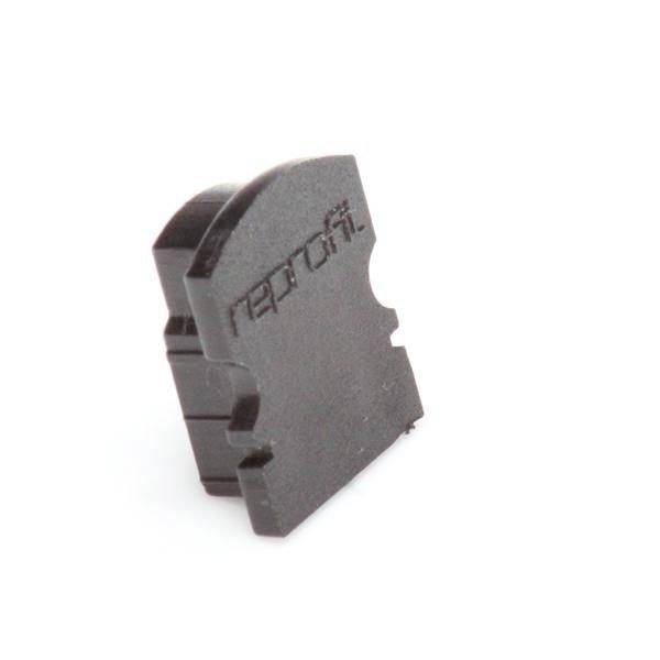 Ein braunes Bauteil mit einer geriffelten Oberfläche und der Aufschrift 'nepros'. Es scheint ein technisches oder industrielles Teil zu sein.