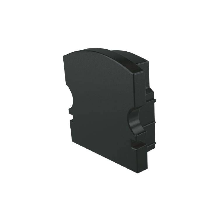 Ein schwarzer, rechteckiger Kunststoffblock mit abgerundeter Oberkante und Schlitzen an den Seiten.