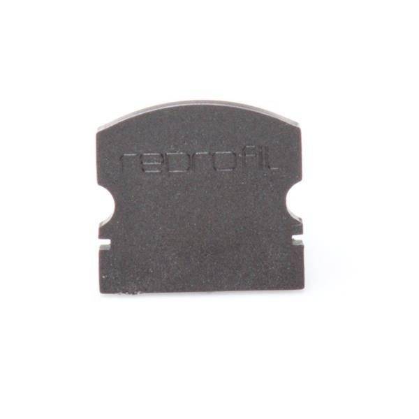 Ein kleines rechteckiges Bauteil mit dem Schriftzug 'redprofil' darauf, vermutlich ein technisches oder elektronisches Element.