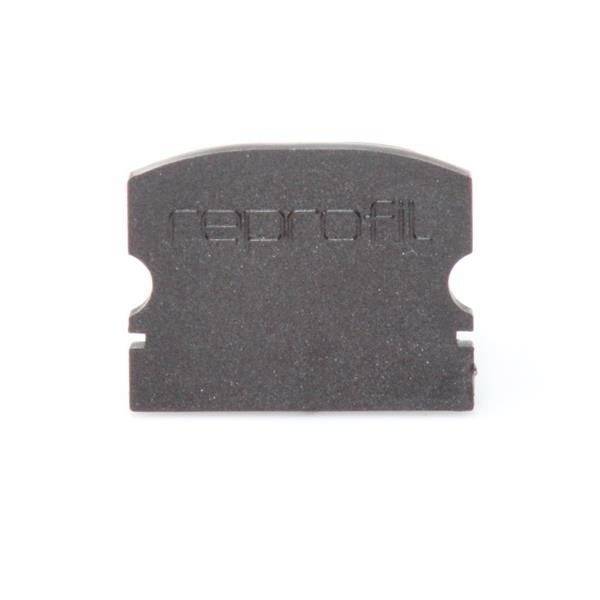 'Etikett' ist in schwarzen Buchstaben auf einem kleinen, rechteckigen Kunststoffteil eingeprägt.