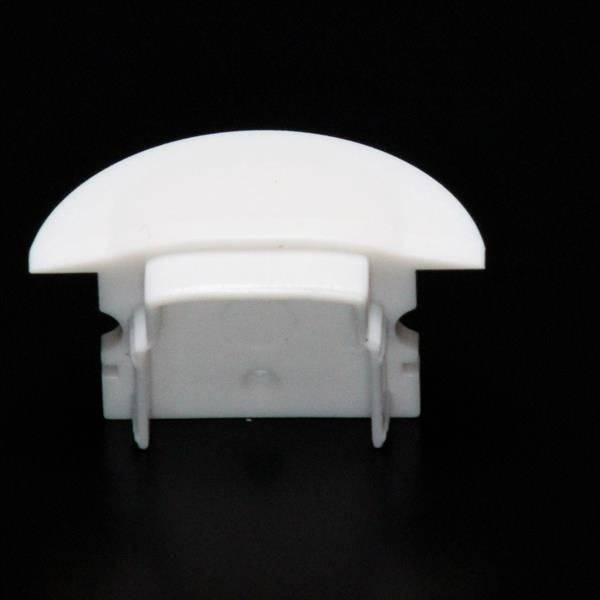 Ein weißer, halbkreisförmiger Kunststoffclip auf schwarzem Hintergrund, wahrscheinlich ein Endkappen- oder Kabelmanagement-Zubehör.
