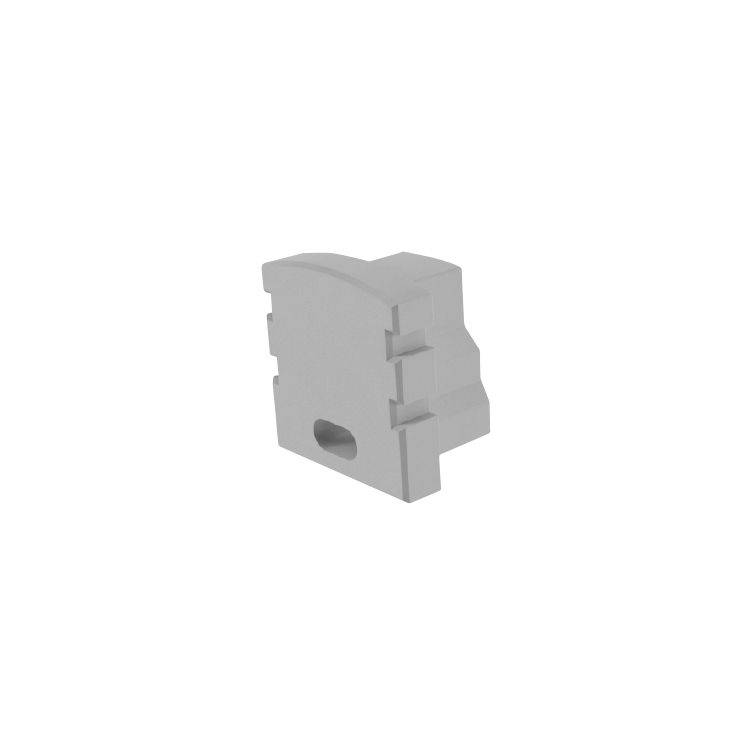 Ein kleines, graues, rechteckiges Bauteil mit einer runden Öffnung in der Mitte vor einem weißen Hintergrund.