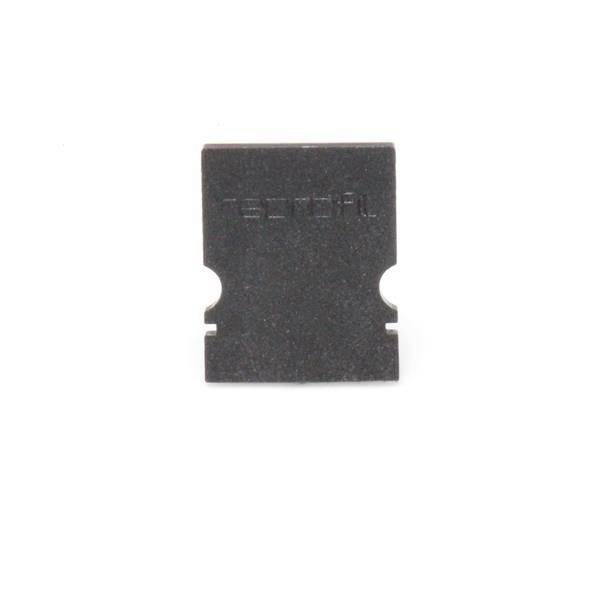 Ein schwarzes, rechteckiges Elektronik-Bauteil mit dem Aufdruck 'Toshil' ist zu sehen.