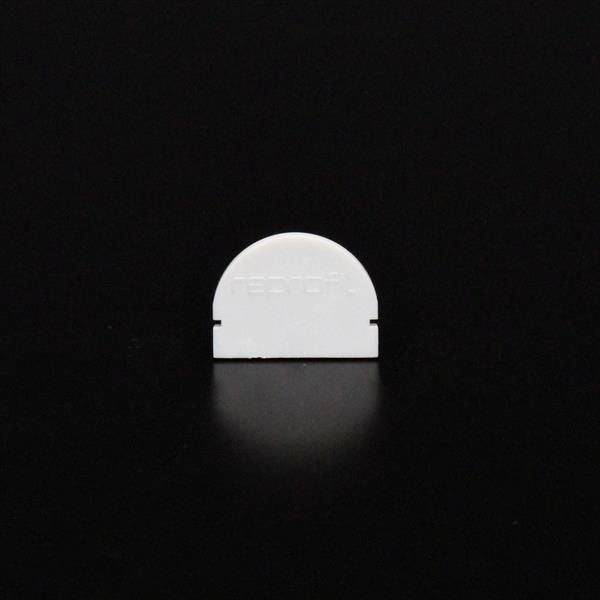 Weißer, halbkreisförmiger Gegenstand auf schwarzem Hintergrund.