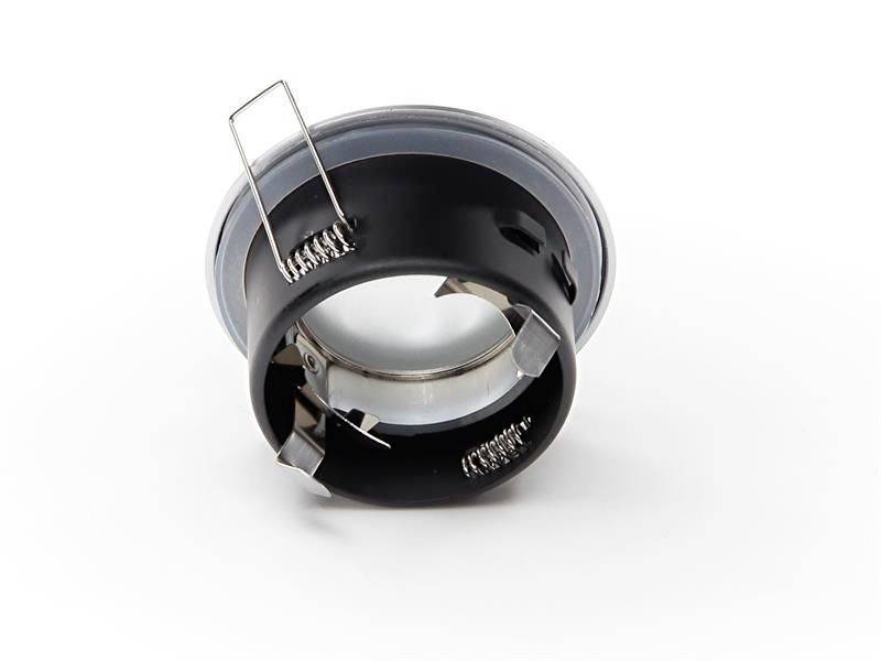 Schwarzes Metallteil mit Federklemmen auf beiden Seiten und einem transparenten Plastikring oben.