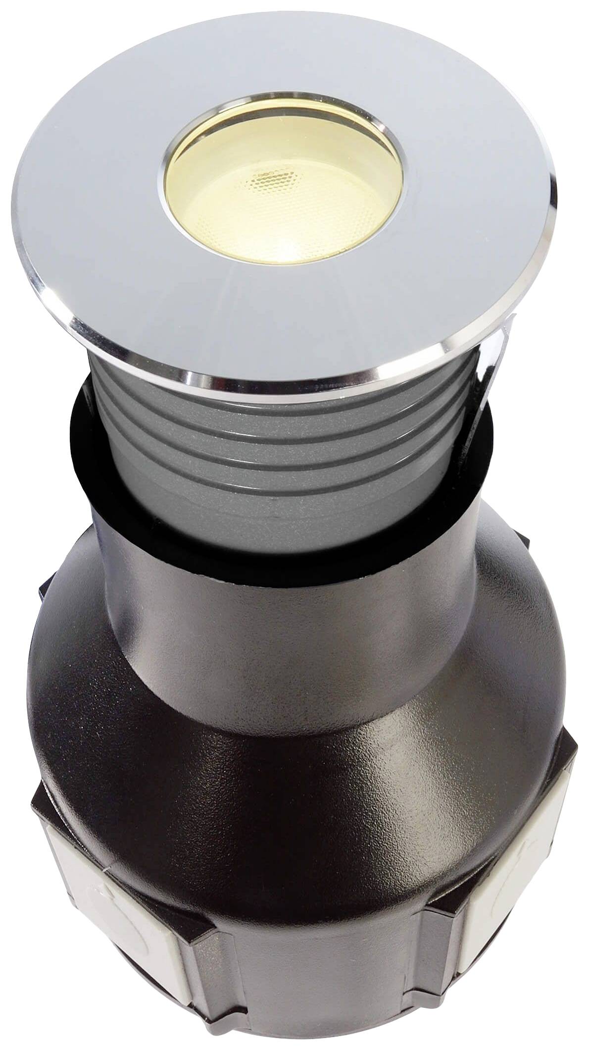 Schwarzer, zylindrischer Bodeneinbaustrahler mit chromfarbener Umrandung und Glasabdeckung. Designed für Außenbeleuchtung.