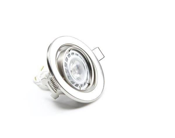 Eine runde Deckenleuchte mit metallener Umrandung und integriertem LED-Spot, seitlich liegend auf weißem Hintergrund.