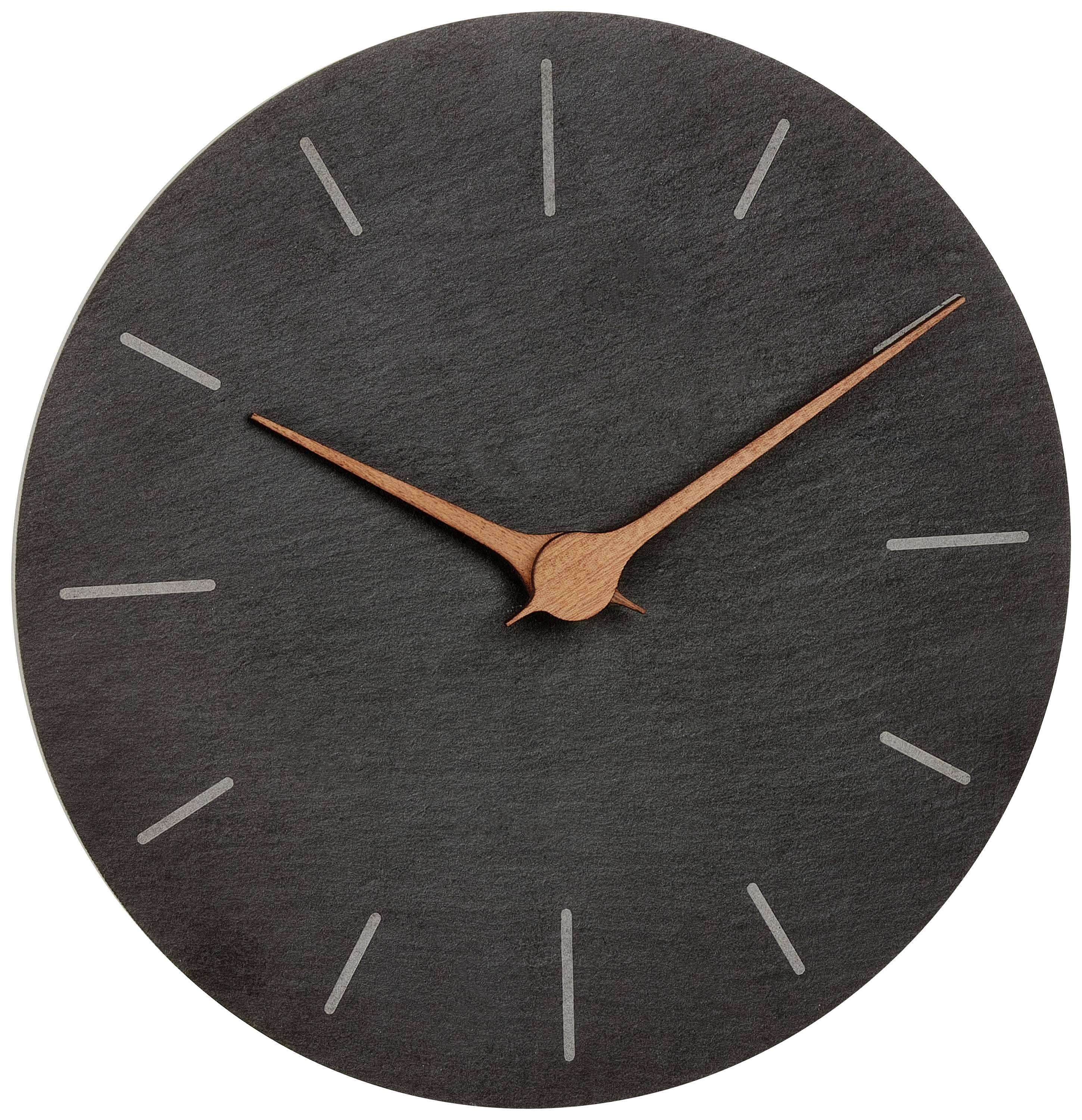 Eine schlichte Wanduhr mit dunklem Zifferblatt und kupferfarbenen Zeigern ohne Zahlen.