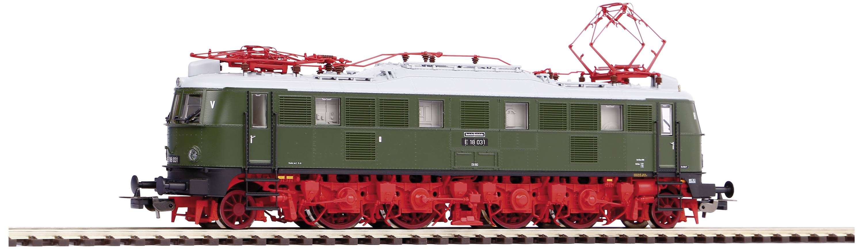 Ein Modellzug einer Elektrolokomotive auf Schienen. Die Lokomotive ist grün mit roten Rädern und hat ein rotes Stromabnehmersystem.