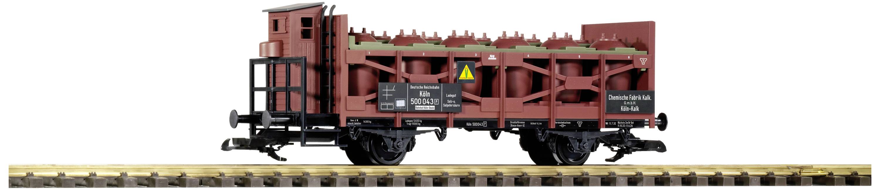 Ein Modell eines Güterwaggons auf einem Gleis. Der Waggon ist rot und trägt mehrere zylindrische Ladungen.