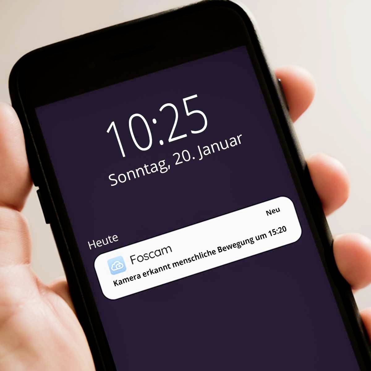 Ein Smartphone zeigt den Sperrbildschirm, Datum und Uhrzeit 'Sonntag, 20. Januar, 10:25'. Benachrichtigung von 'Foscam' über erkannte Bewegung.