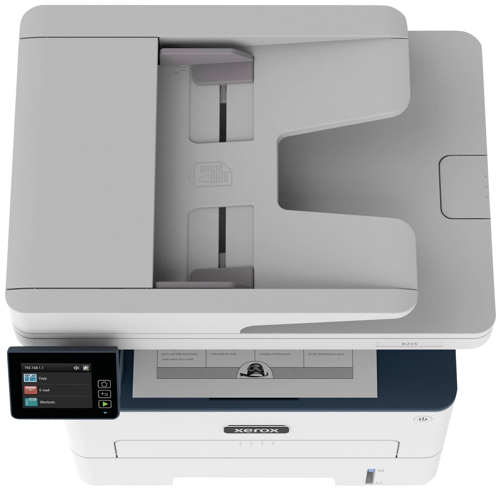 Ein grauer Multifunktionsdrucker. Ansicht von oben mit Display links, das Optionen wie 'Kopie' und 'Scan' anzeigt.