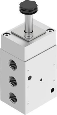 Ein weißes pneumatisches Ventil mit schwarzem Drehknopf oben und drei runden Öffnungen an der Seite.