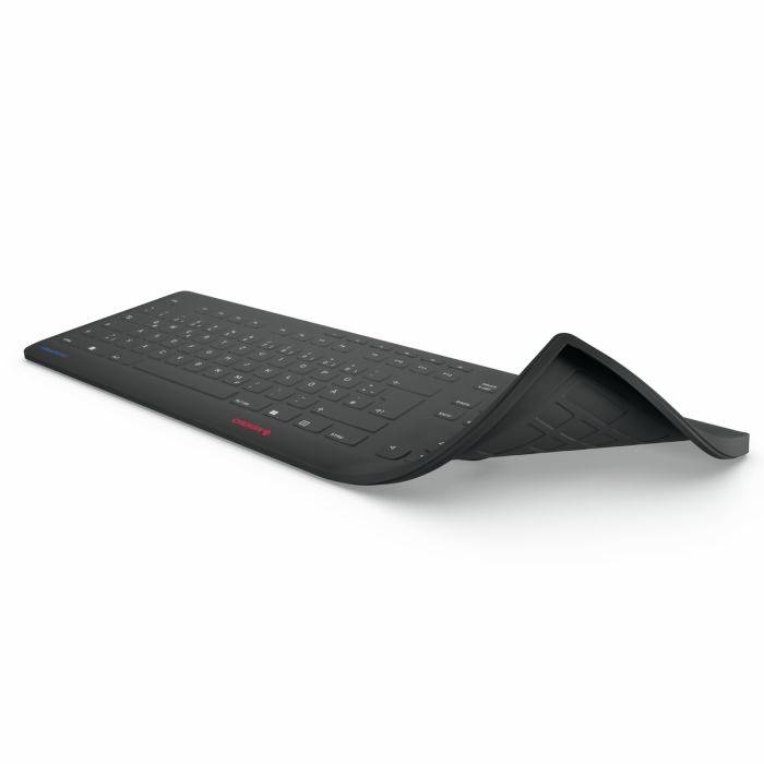 Schwarze, flexible Tastatur, teilweise aufgerollt, zeigt ihre biegsame Natur. Ideal für mobile Benutzer aufgrund ihrer Transportfähigkeit.