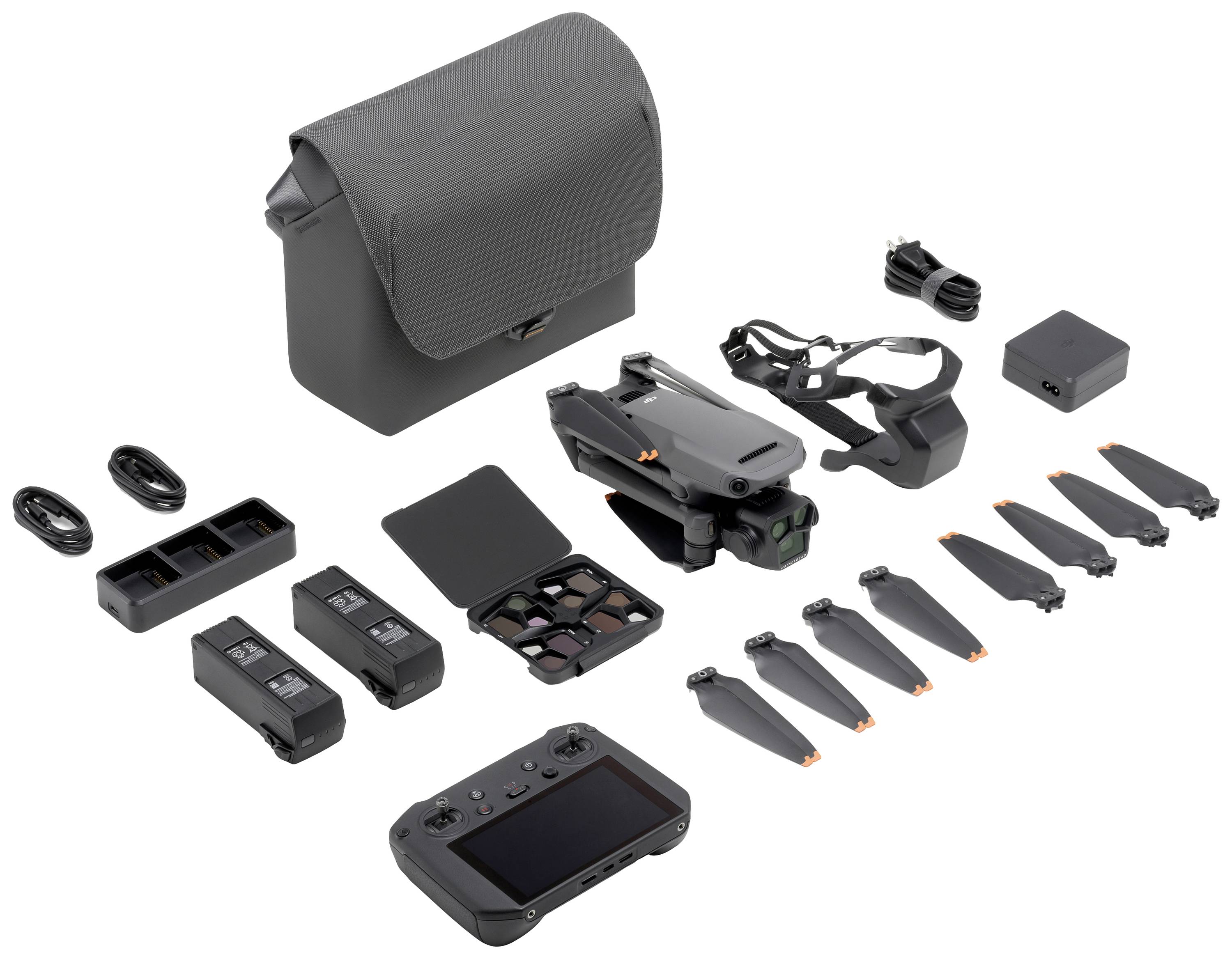 Drohnen-Set mit Fernbedienung, Akkus, Propellern, Ladegerät und Tragetasche. Kompaktes Design, geeignet für Fotografie und Videoaufnahmen.