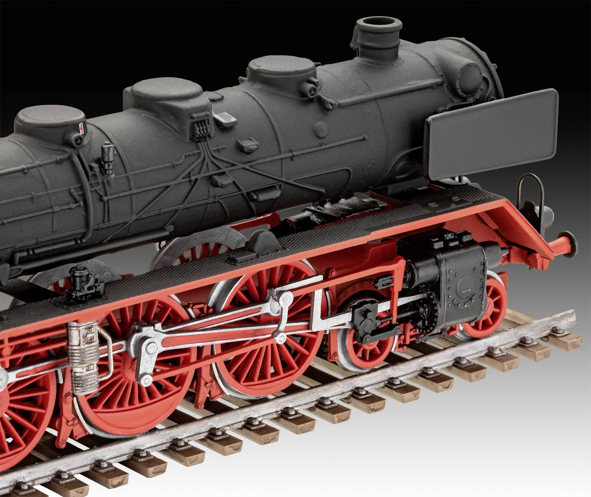 Ein detailliertes Modell einer historischen Dampflokomotive mit roten Rädern und schwarzem Kessel, auf einem kurzen Gleisabschnitt.